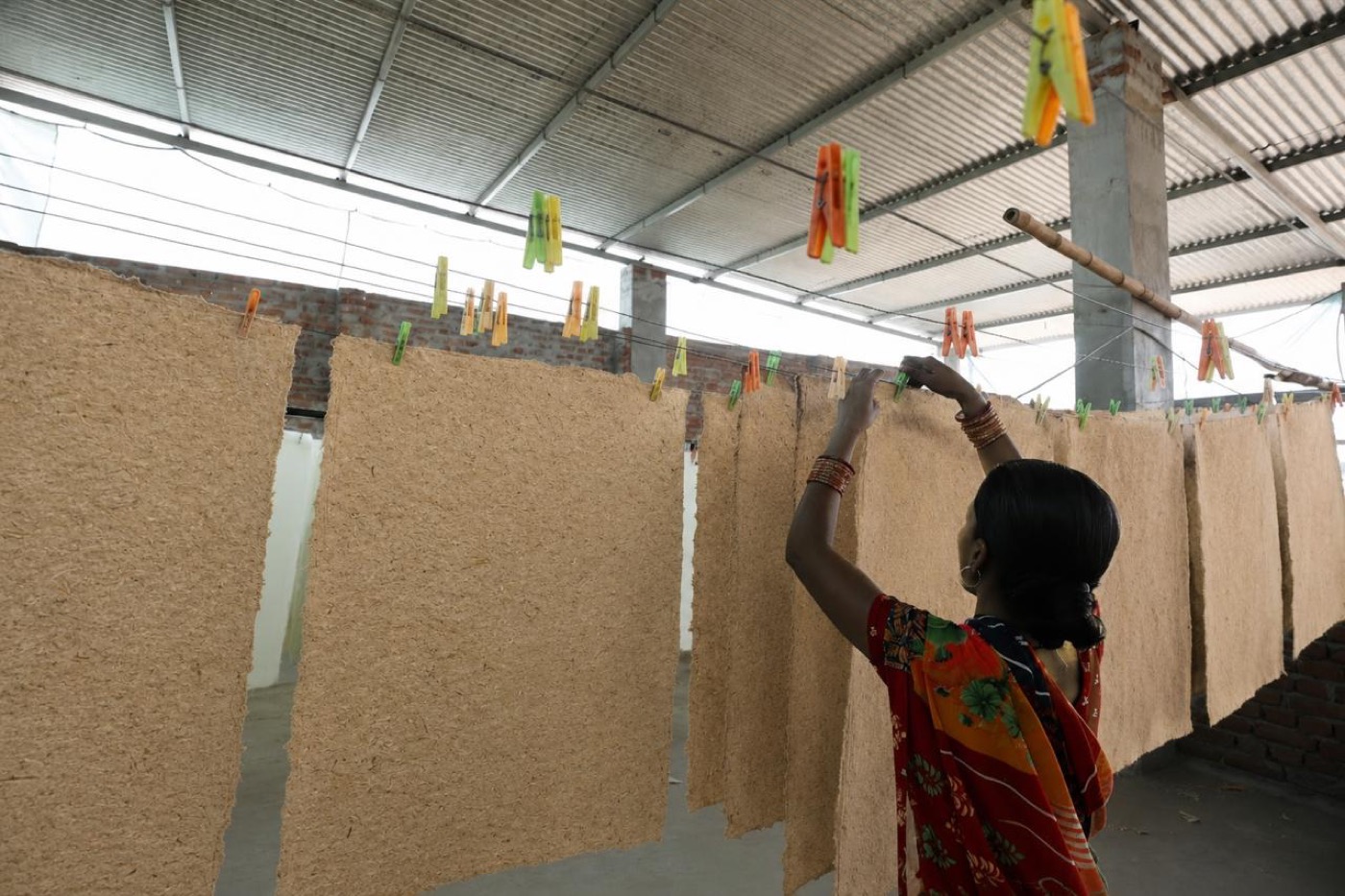 Farmer Paper sheets drying naturally